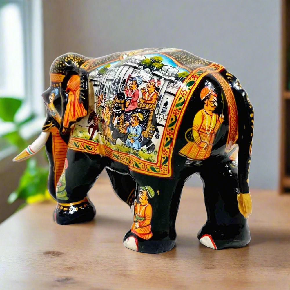 Royal wooden elephant statue with intricate Mughal miniature art, reflecting Indian heritage and craftsmanship.