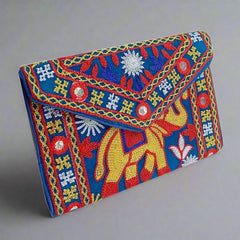 Silk clutch purse with intricate embroidery, zip compartment, and handle, perfect for girls and women.