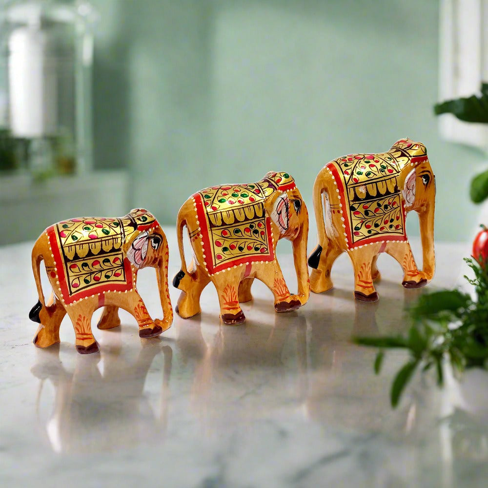 Wooden elephant set in small, medium, and large sizes for home decoration.