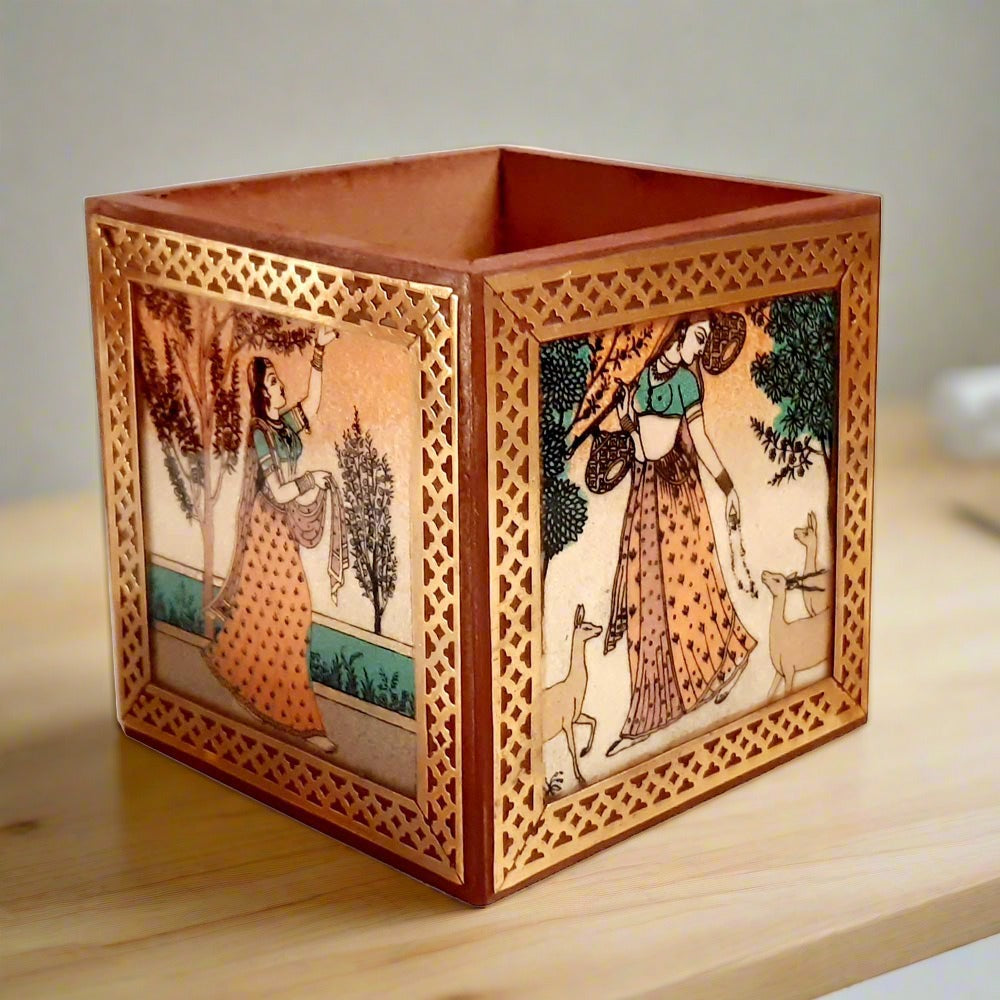 A square wooden desk organizer featuring beautiful gemstone painting all around.