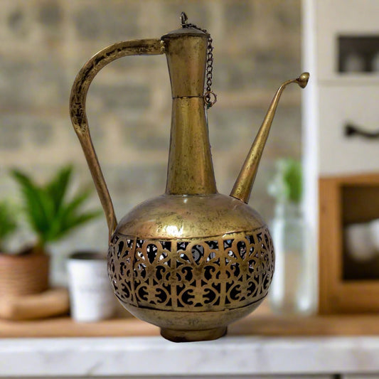 Surahi-shaped metal candle holder with lattice design and gold oxidized painting, inspired by royal Maharaja tradition.