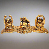 Three-piece set of metal Laughing Buddha statues decorated with golden oxidize polish, symbolizing happiness and peace.