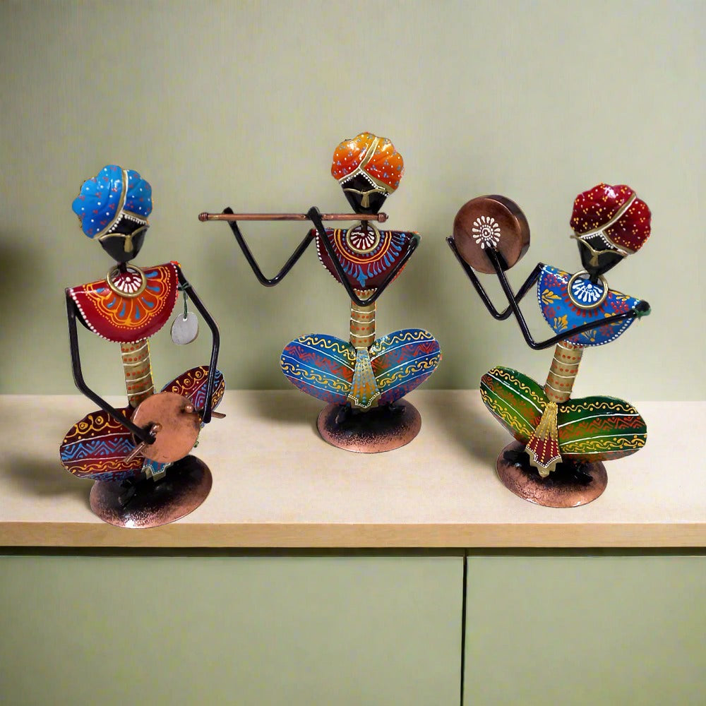 Three-piece metal musician set from Rajasthan with beautiful colorful hand painting, ideal as decorative showpieces.