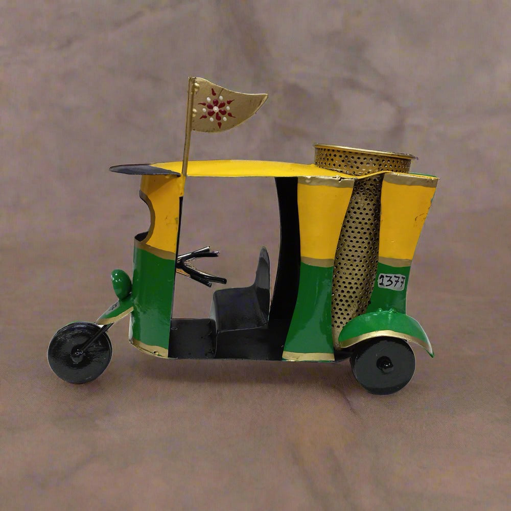 Traditional Indian auto rickshaw metal pen stand decorated with hand painting, featuring round pen holder for pens and markers.