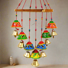 Traditional toran decorated with bright beads and brass bells, perfect for festival wall decoration.