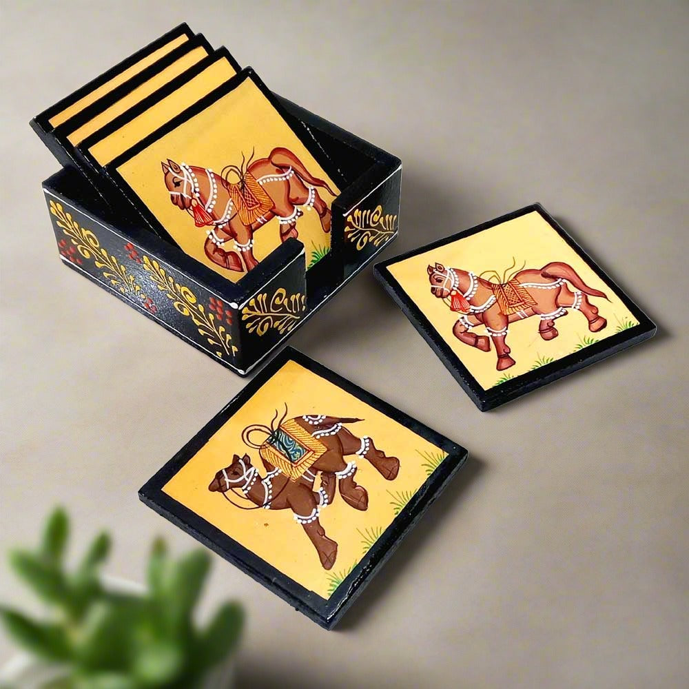 A set of traditional drink coasters with hand-painted animal designs, a great gift for an office desk.