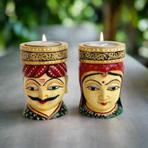 Traditional wooden tea light candle stand featuring hand-painted faces of Kaka with pagdi and Kaki with odhani.