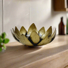 Traditional metal lotus candle stand crafted with detailed bloom leaves design, a beautiful temple accessory.
