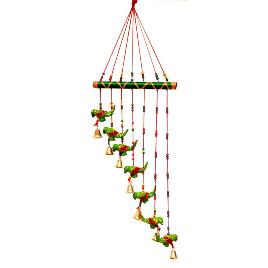 Traditional papermache toran decorated with hand-painted green parrots and golden bells for festive home decor.
