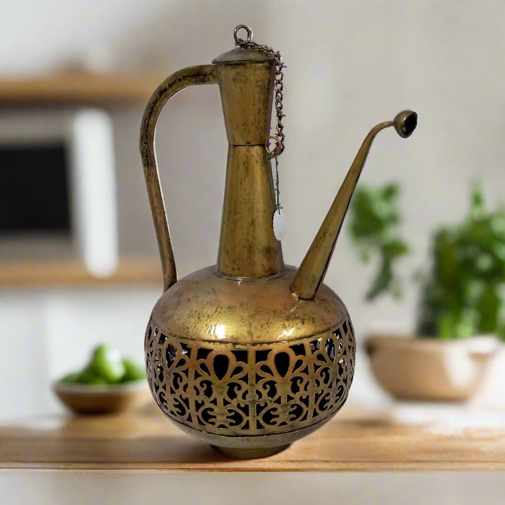 Traditional surahi-inspired metal candle holder with detailed gold oxidized paint and lattice work for decorative lighting.