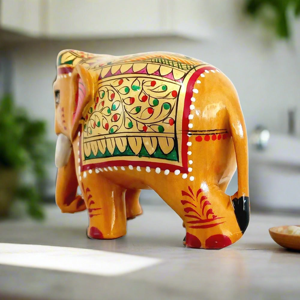 Wooden elephant with red and green floral hand painting on gold base, beautiful home and gift decoration
