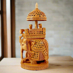 Handmade traditional Ambabari elephant figurine in wood, showing the mahout and royal riders in palanquin.