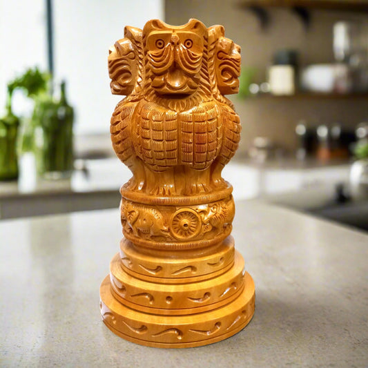 Handcrafted wooden Ashoka pillar with four lions and Ashoka emblem.