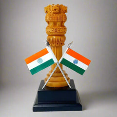 Handcrafted wooden Ashoka Pillar national symbol of India on dark brown platform with two Indian flags