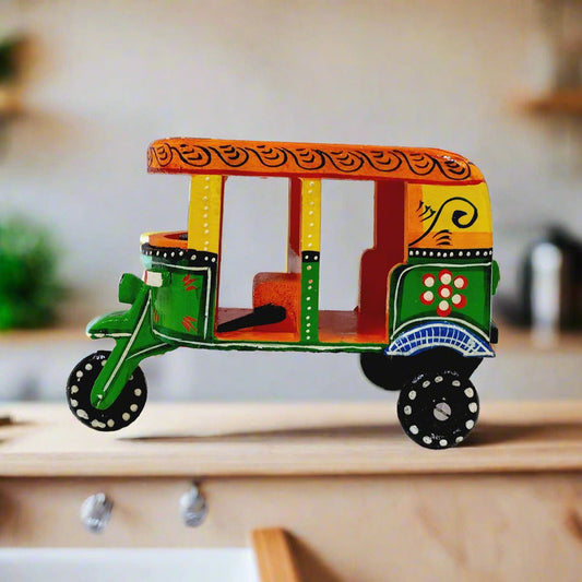 Wooden auto rickshaw showpiece with traditional hand art and vibrant color combination, perfect for home decor and gifting.