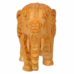 Wooden carved elephant idol with detailed undercut artwork.