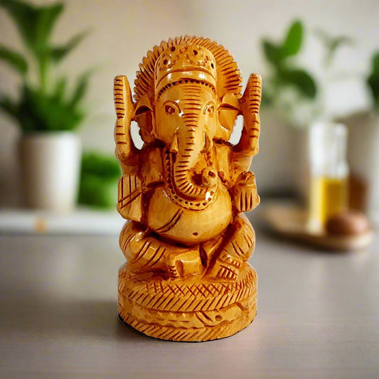 Handcrafted wooden round Ganesh idol sitting giving blessings front view.