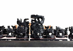 A complete set of wooden chess pieces in the Ambabadi style, along with a 15-inch playing board.