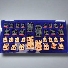 A wooden chess set with Ambadi figurine pieces, designed to enhance the beauty of your home.