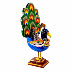 A wooden dancing peacock, a beautiful table showpiece and a memorable gift.
