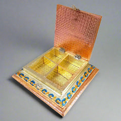 Open interior of decorative dry fruit box showing 4 partitions for assorted dry fruits