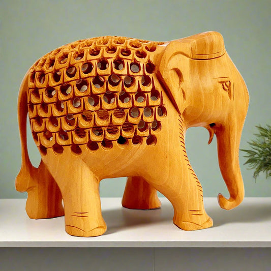 Wooden elephant idol with low trunk, mesh stomach design, and baby elephant inside, ideal for home decor and gifting
