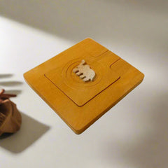 A square-shaped wooden pocket mirror with a beautiful elephant design on it.