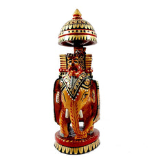 A beautiful wooden elephant sculpture for tabletop decoration.