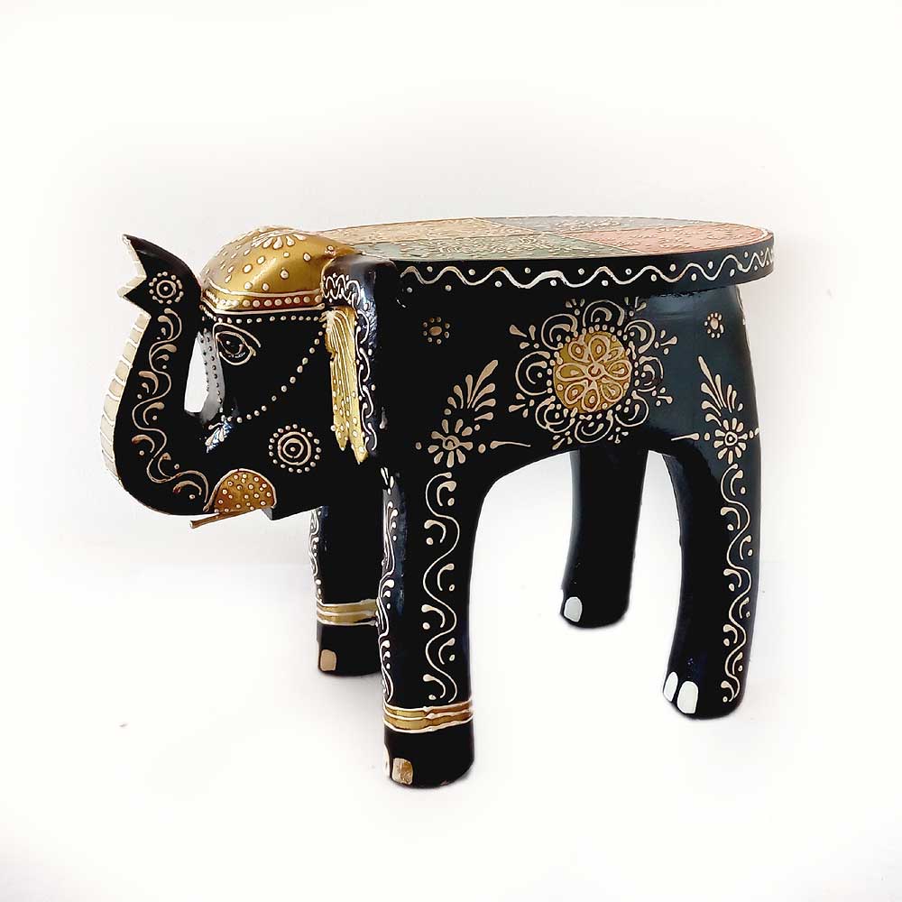 A wooden elephant that can be used as a comfortable sitting stool or a decorative display stand.