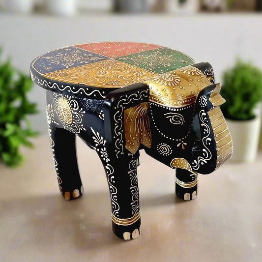 A beautiful wooden elephant stool with wonderful emboss painting, perfect for home decor.