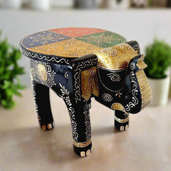 A beautiful wooden elephant stool with wonderful emboss painting, perfect for home decor.