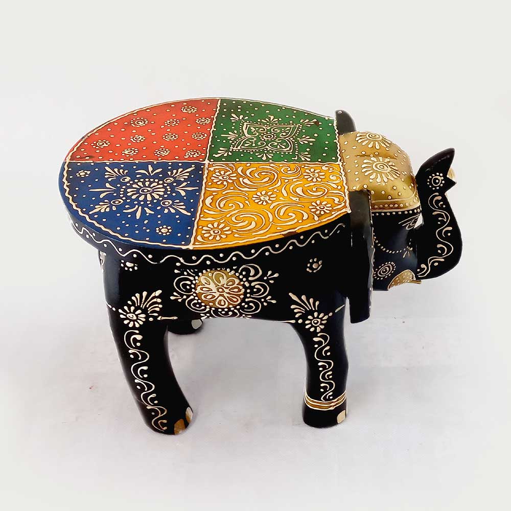 A wooden elephant stool with wonderful emboss painting, a unique piece for interior design.