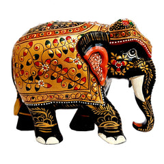 A wooden elephant with a detailed emboss design, completely handmade.