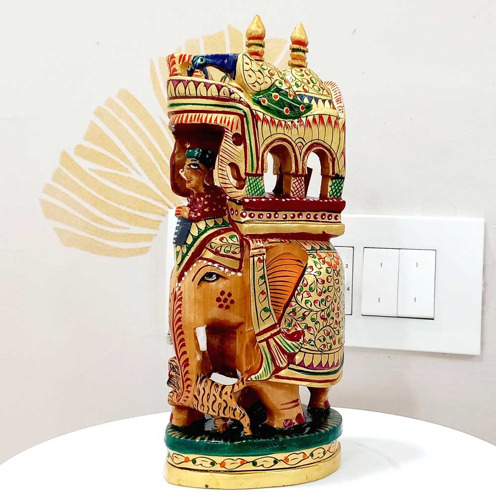 A wooden elephant with a beautifully textured howdah (pavilion) and miniature painting, an antique piece for decor.