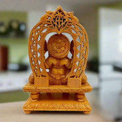 A wooden Ganesha showpiece with a masand on both sides, a best gift item for Ganesha lovers.