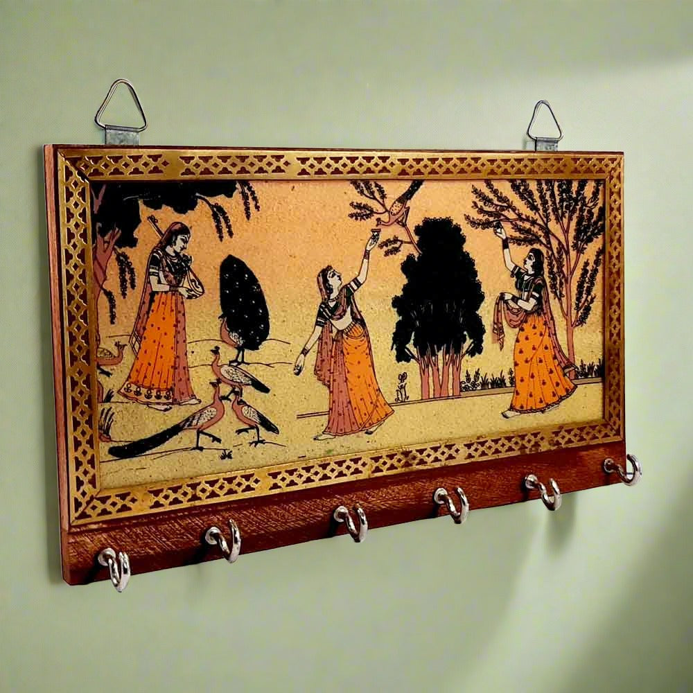 A wooden key holder with 6 hooks, decorated with a handcrafted gemstone painting on a glass base.