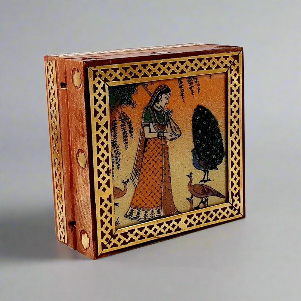 Wooden jewel box featuring semi-precious crushed stone painting of a lady on a glass base, with brass accents.