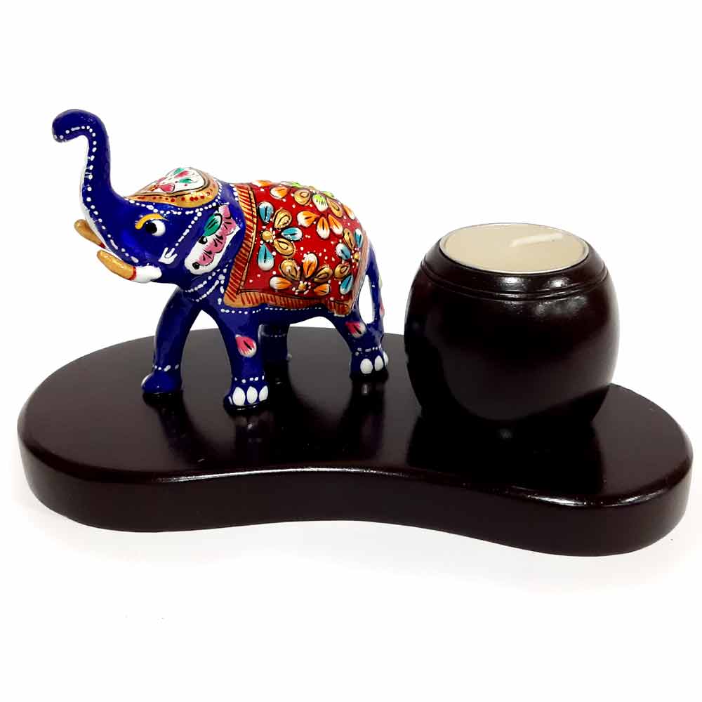 A wooden and metal elephant showpiece with a candle holder, a great gifting idea for any occasion.