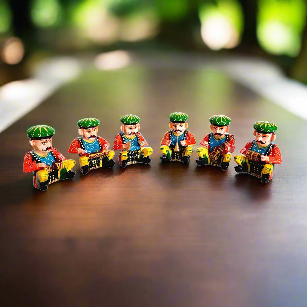 A set of six colorful wooden musicians, a traditional art of Rajasthan.