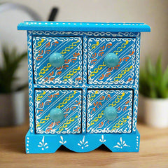 A wooden organizer with 4 drawers for storing earrings, jhumkas, chains, and other jewelry.