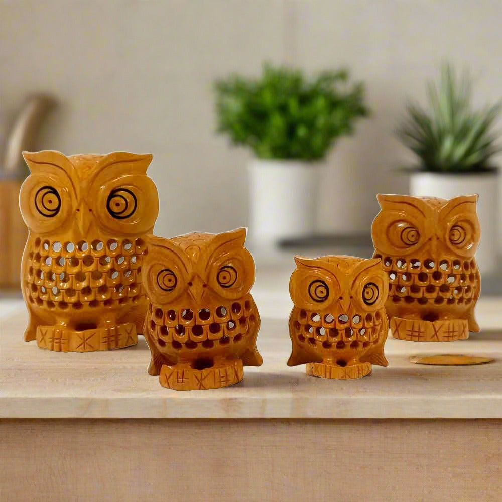 Handcrafted wooden owl bird statues with black eyes, made from kadam wood, ideal for home decor and gifting.