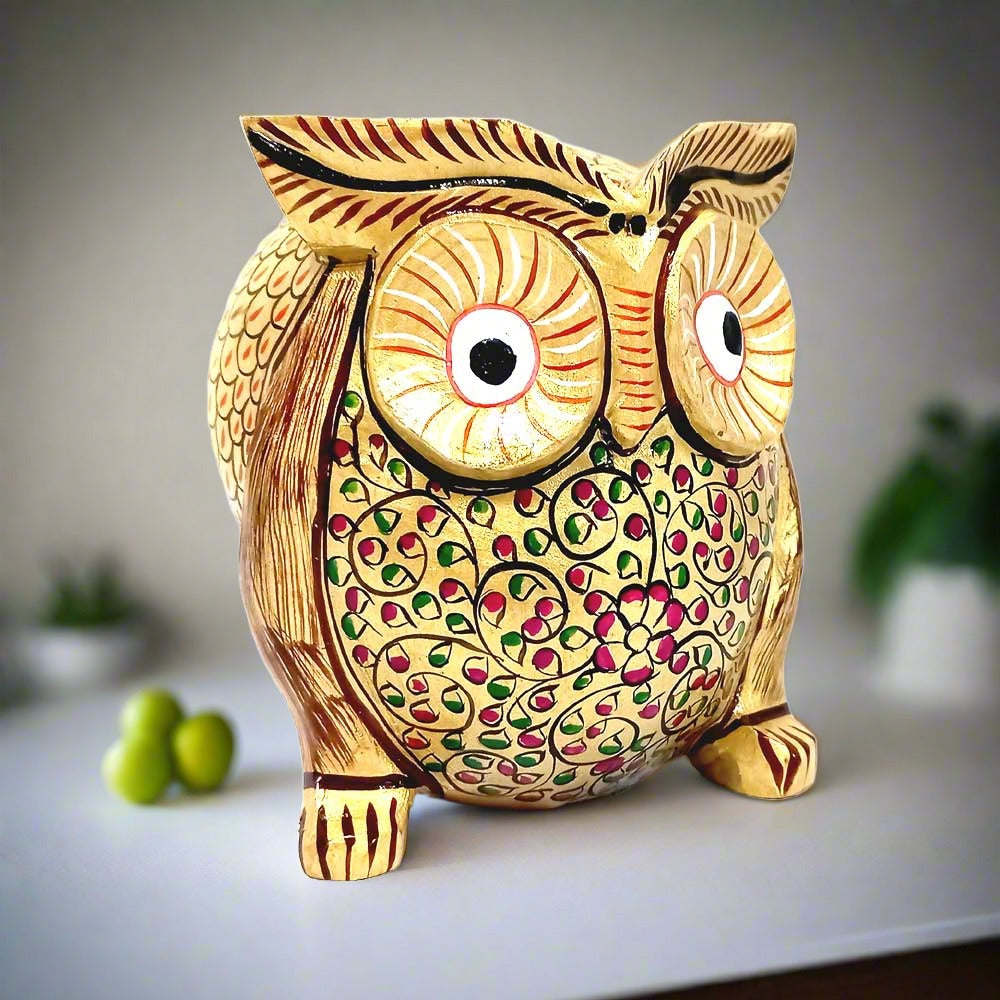 A stunning wooden owl showpiece used for home decoration and Vastu Shastra.
