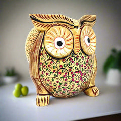 A stunning wooden owl showpiece used for home decoration and Vastu Shastra.