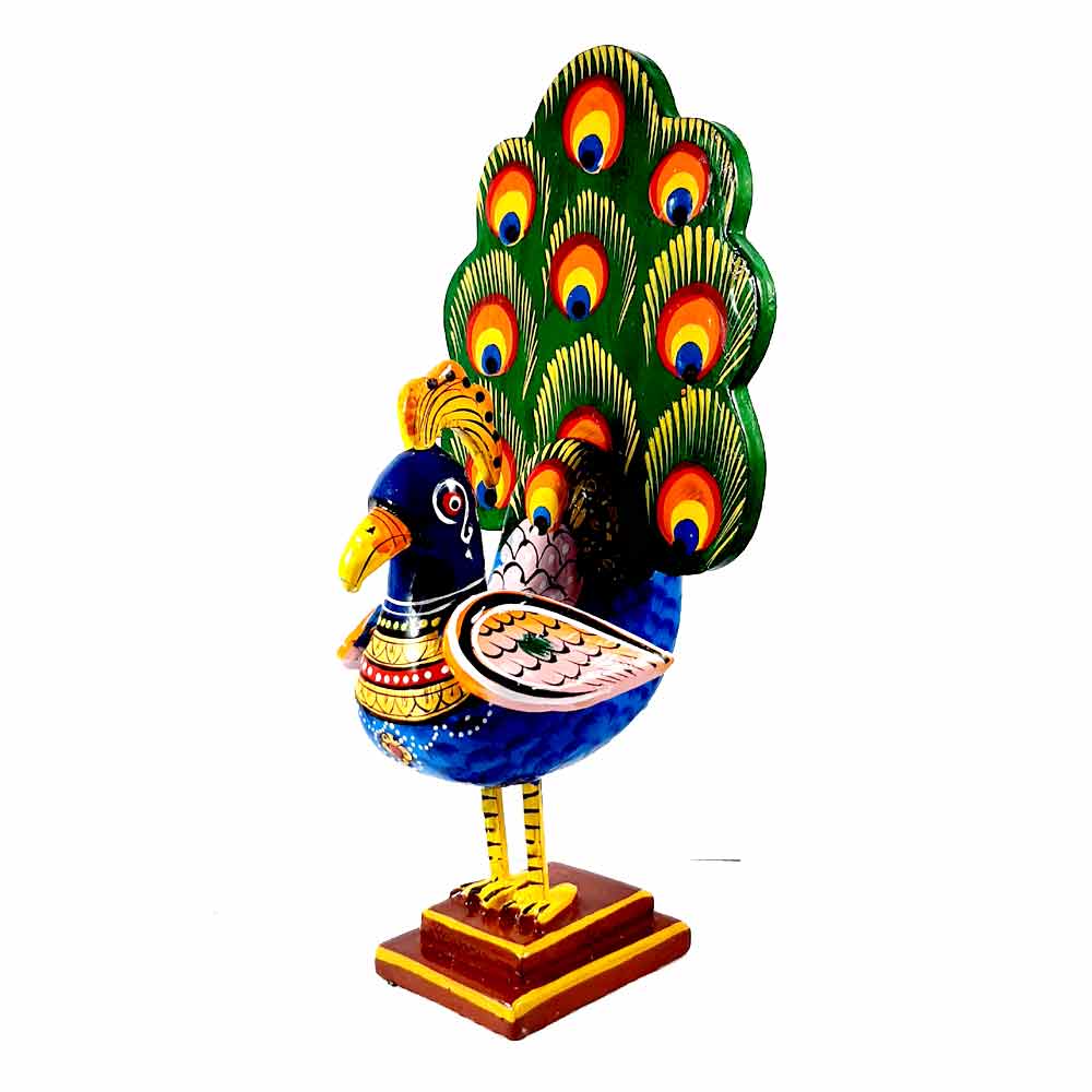 A beautiful wooden peacock that is great for decorating your space or giving as a gift.