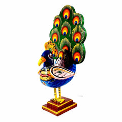 A beautiful wooden peacock that is great for decorating your space or giving as a gift.