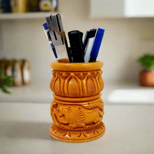 A new design wooden pen stand with a beautifully carved lotus on top and different animals on the lower side.