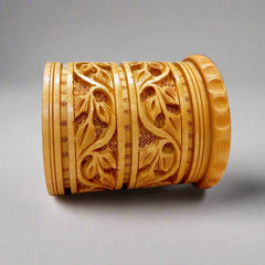 Kadamba wood pen holder with intricate leaf carvings, ideal for storing pens, pencils, and markers