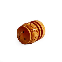 A wooden pooja room incense stick holder with a well-carved design.