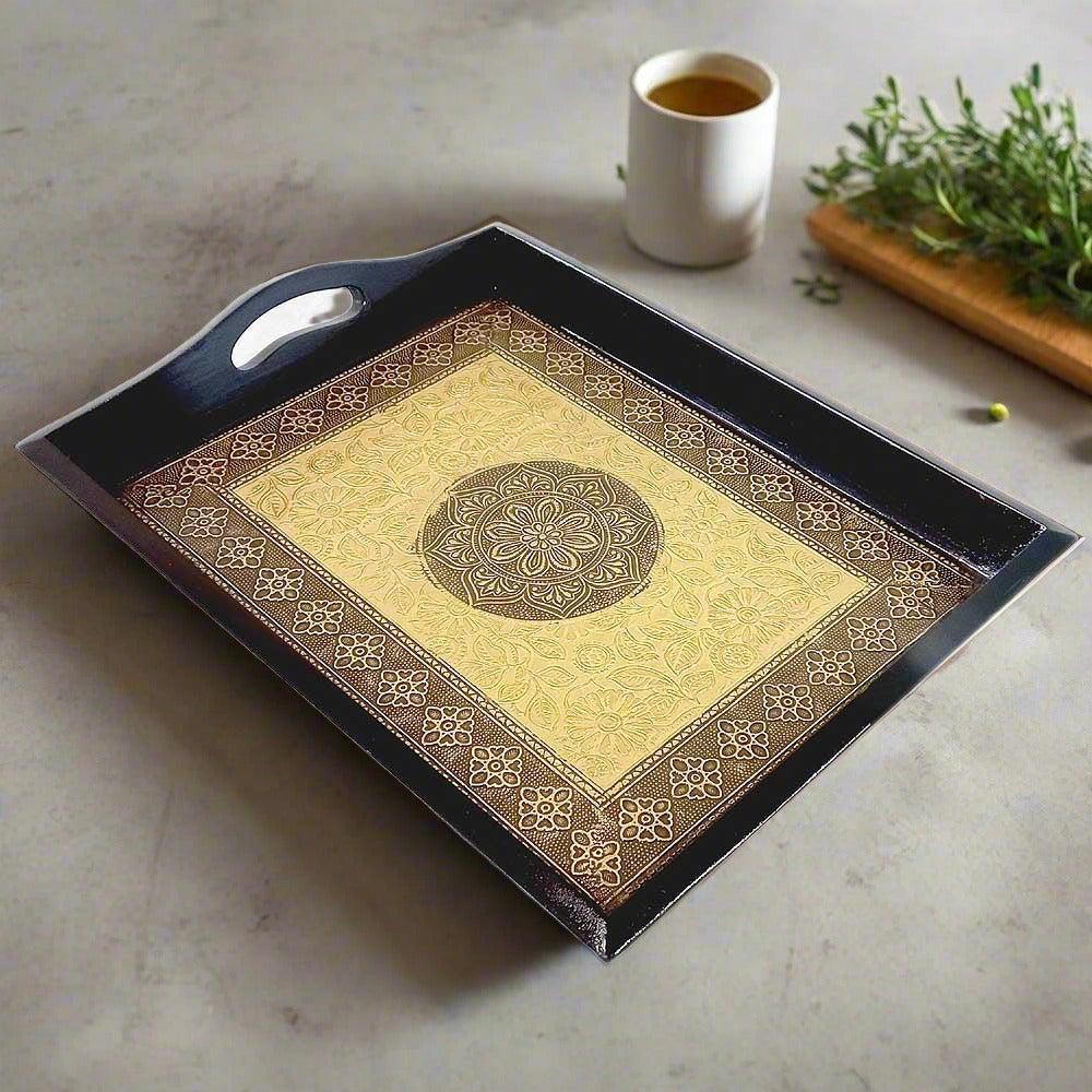 A high-quality wooden serving tray with an embossed floral design and a golden and copper metal sheet interior.