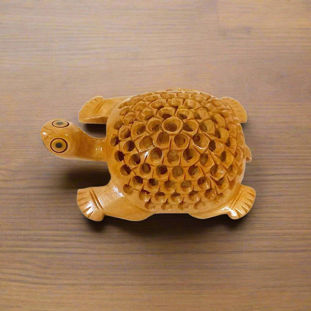 Wooden tortoise statue featuring intricate lattice design on the back, considered auspicious for home and office.